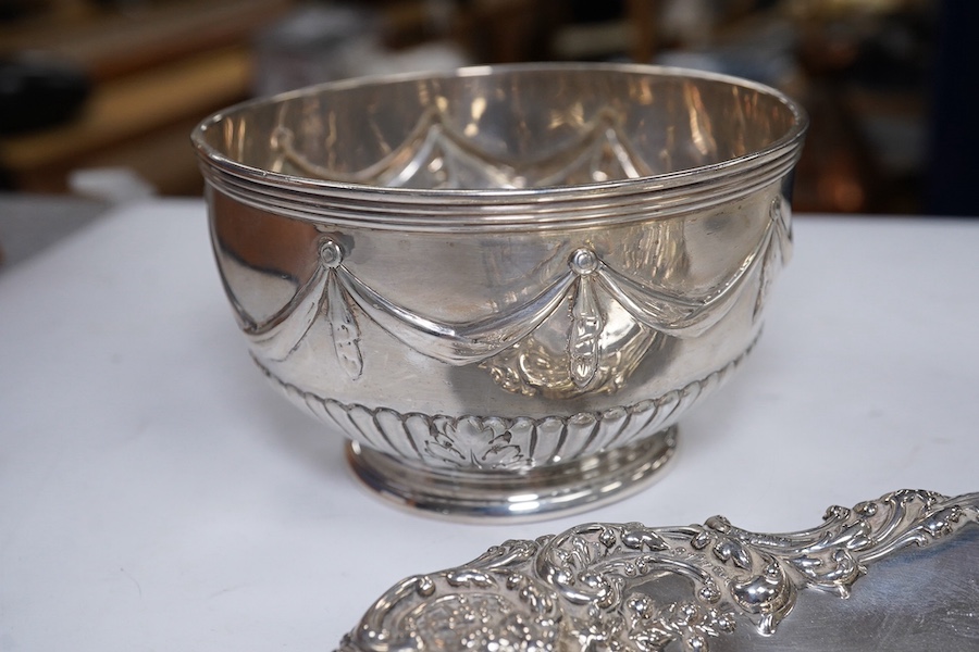 Two Victorian silver sugar bowls, a Victorian silver gilt sifter ladle and a repousse silver dish, 11.8oz. Condition - fair to good